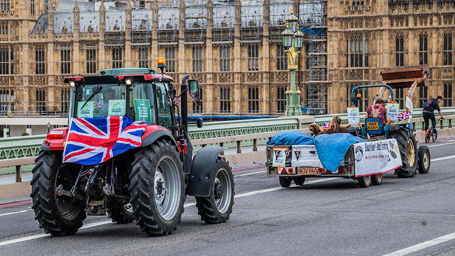 Mandatory Credit: Photo by Guy Bell/Shutterstock (10705500c)
Passing over Westminster Bridge - A slow convoy of tractors drives from New Covent Garden Market to Westminster to object to a possible trade deal with the USA that does not respect British food standards. Save British Farming and Extinction Rebellion protest on the day Rishi Sunak delivers a summer economic update to Parliament.
Save British Farming and Extinction Rebellion protest on the day Rishi Sunak delivers a summer economic update to Parliament., Westminster Bridge, London, UK - 08 Jul 2020